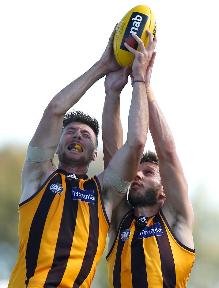 AFL 2016 NAB Challenge - Richmond v Hawthorn Jack Fitzpatrick marks in front of Grant Birchall in the NAB Challenge - ${keywords}